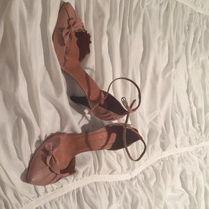 Pale pink strappy heels.